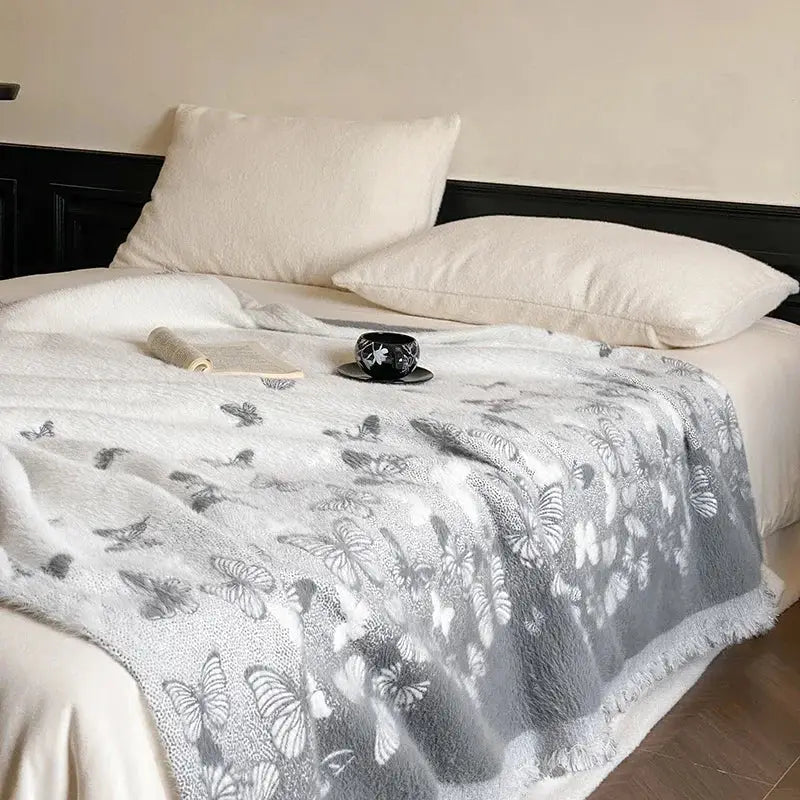 Soft gray butterfly jacquard imitation mink fur blanket with delicate pattern and fringed edges for bedroom decorbites decor