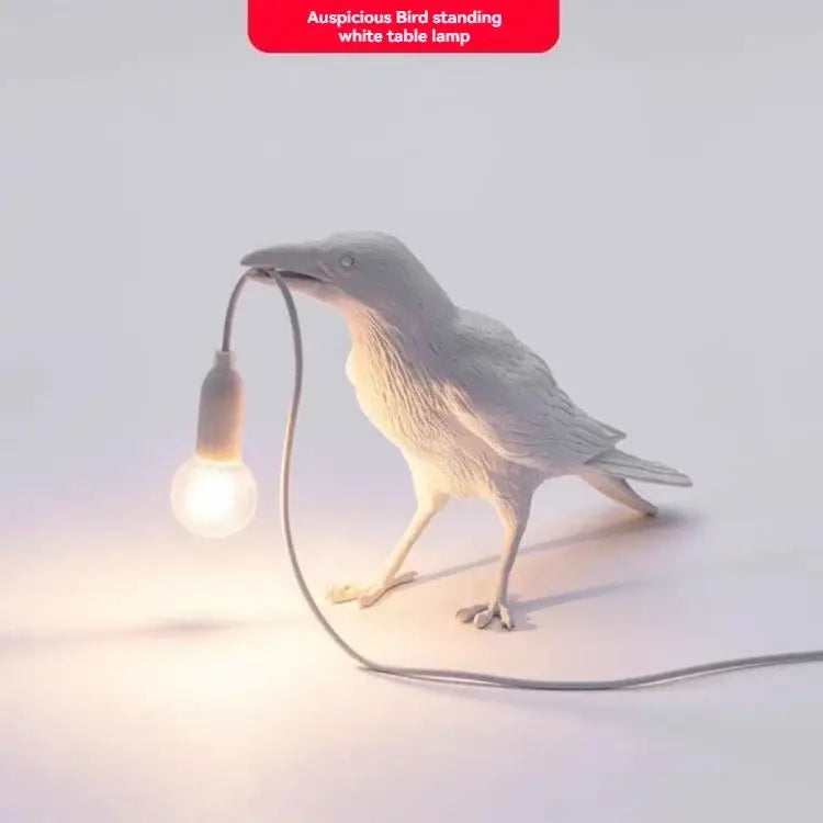Gray ceramic lively bird resin table lamp with a white ceramic bird holding a glowing bulb in its beak for bedroom decorbites lively bird