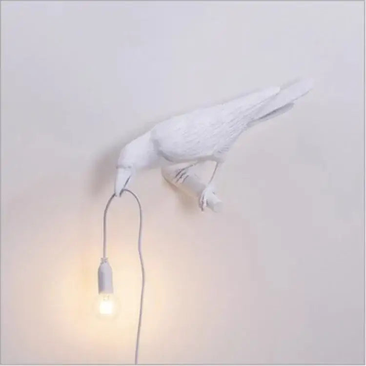 White ceramic lively bird resin table lamp with glowing bulb in beak for bedroom decorbites lively bird decor