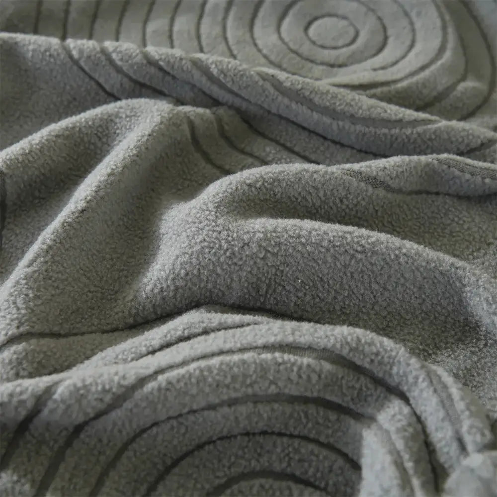 Gray circular textured polar fleece sofa cover with embossed pattern for modular sofas and accent chairs living room use