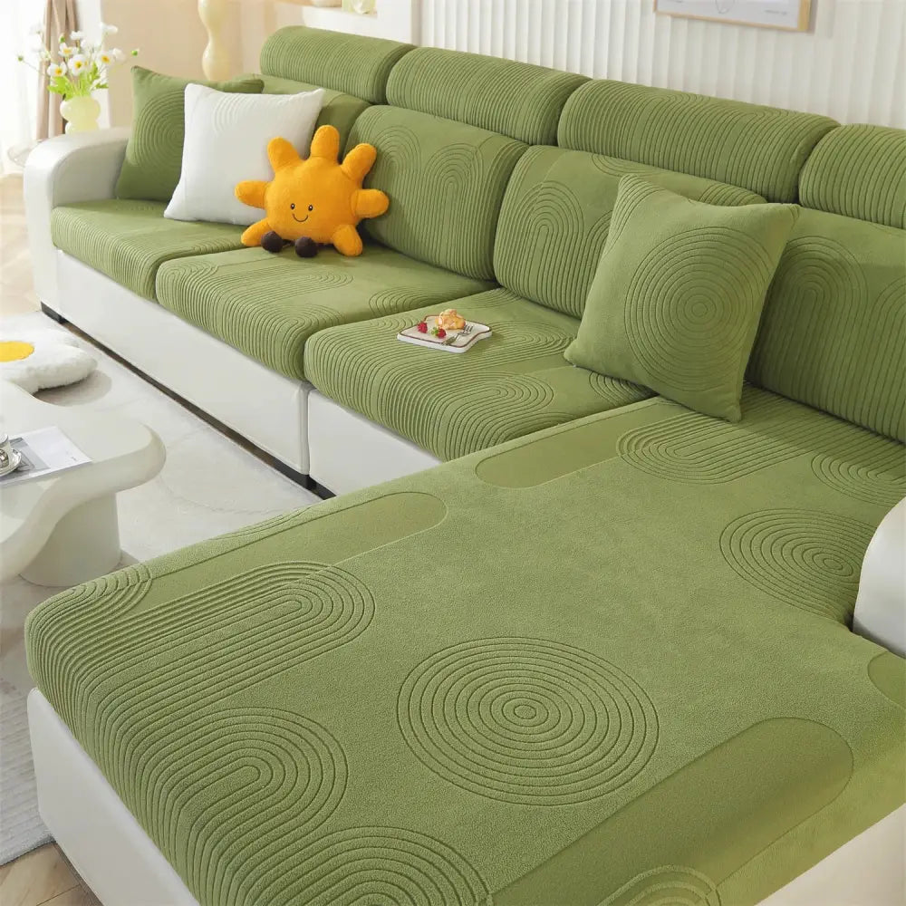 Green corduroy sofa cover with circular ripple embroidery pattern suitable for modular sofas and accent chairs