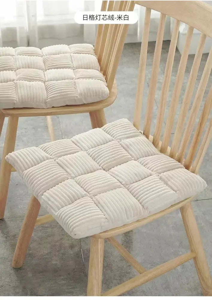 Cream-colored quilted corduroy cushion with grid pattern for dining room chair by decorbites corduroy cushion