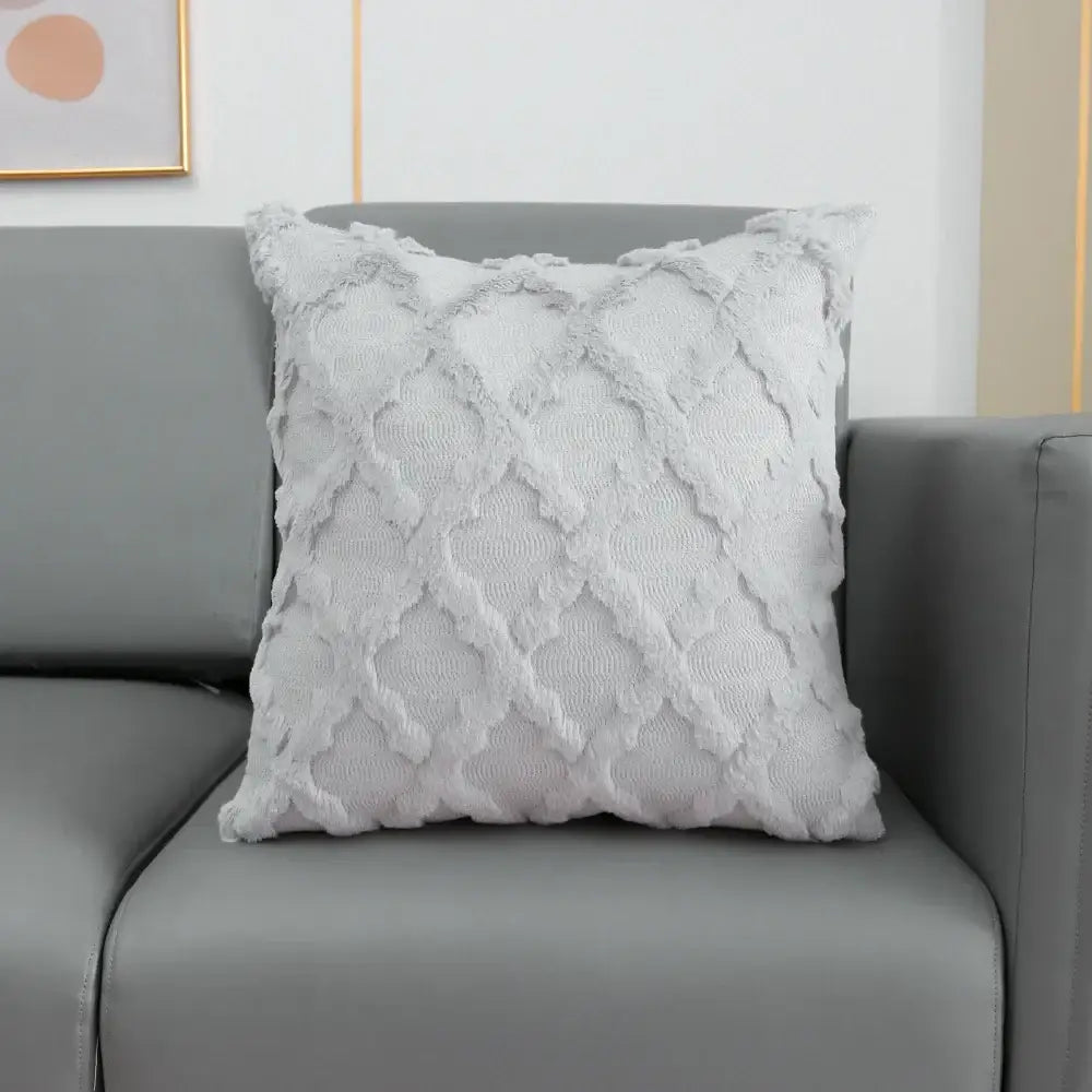 A soft light gray cushion cover with textured diamond pattern and frayed edges featuring decorbites fluffy embroidery decor