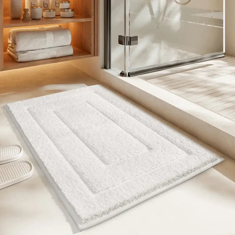 White plush bath mat with textured rectangular striped pattern made of soft terry cloth for decorbites geometric flocked bath