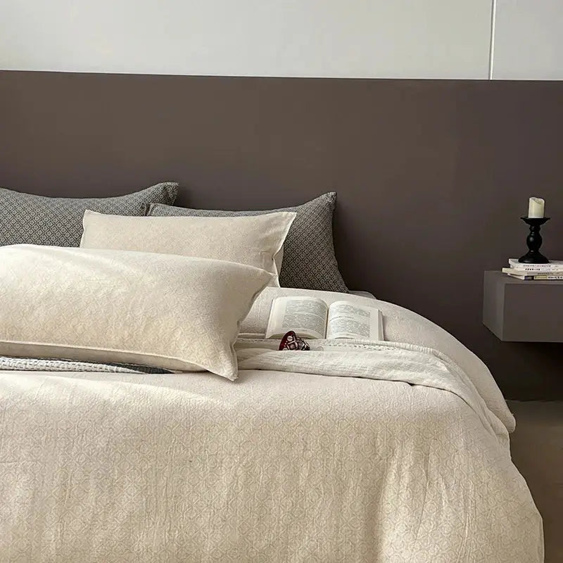 Cream-colored quilted bedspread with subtle textured pattern from gray geometric linen cotton jacquard bedding set decorbites