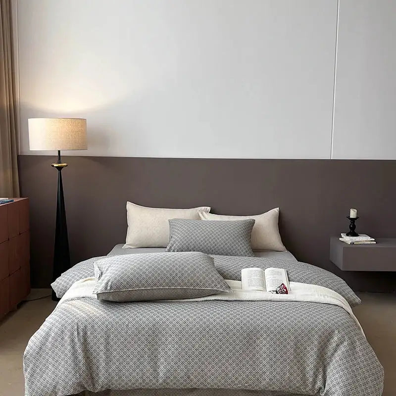 Gray geometric linen cotton jacquard bedding set with subtle pattern matching pillows and soft white blanket for bedroom decor