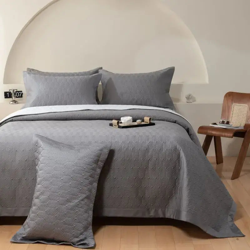 Gray geometric quilted egyptian cotton bedspread set with subtle pattern and matching pillows for bedroom use