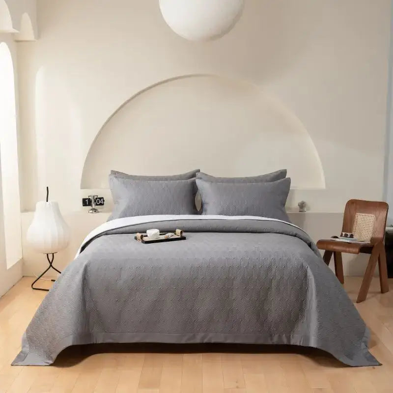 Gray geometric quilted egyptian cotton bedspread set with subtle woven pattern and matching pillows for bedroom use