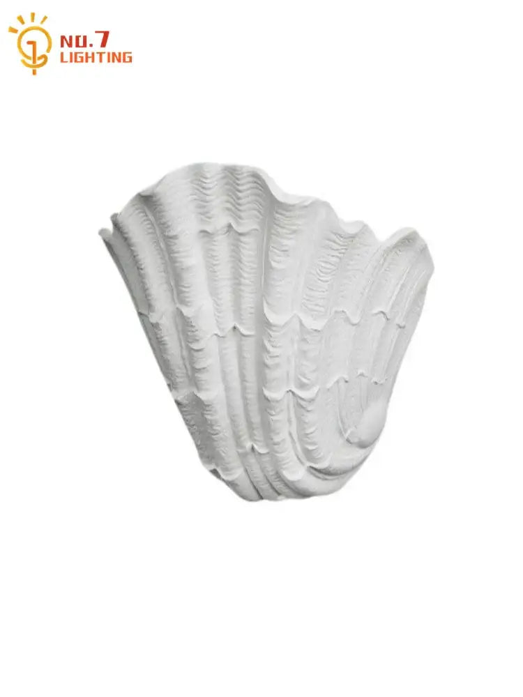 White gypsum shell led wall lamp with textured ridges and smooth glossy finish ideal for bedroom sconce lighting
