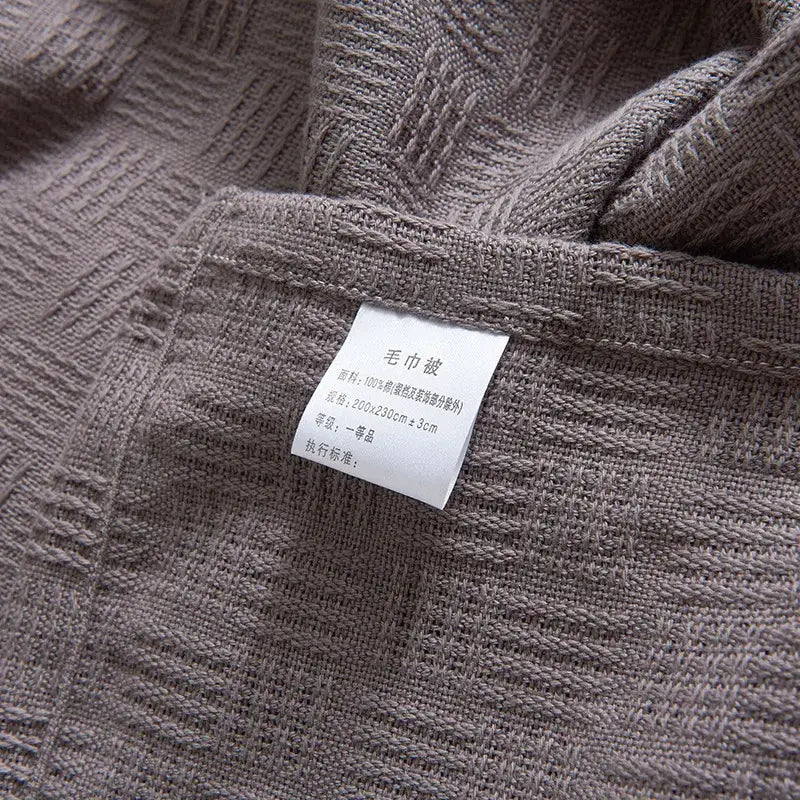 Gray herringbone cotton waffle towel quilt featuring a textured woven cotton waffle decorbites cotton waffle pattern