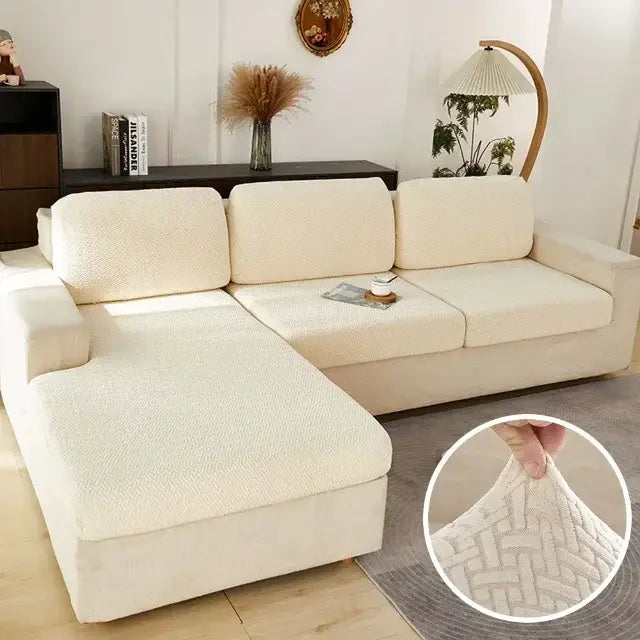 Cream-colored textured fabric sofa cover with subtle woven pattern for gray herringbone stretch living room protector