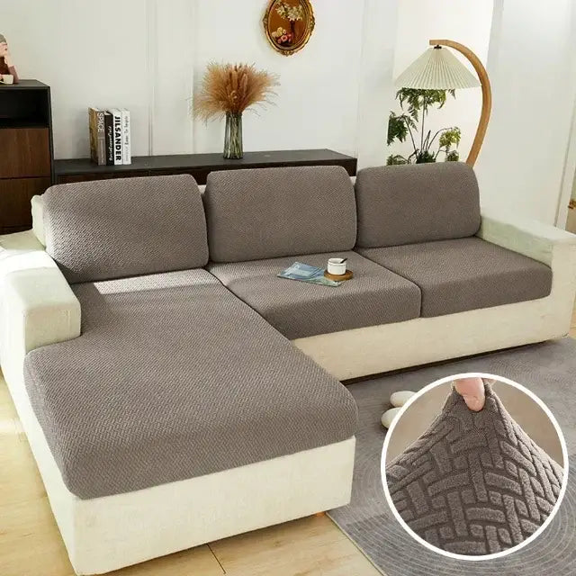 Gray textured fabric sofa cover with woven herringbone pattern designed for l-shaped sectional living room furniture protector