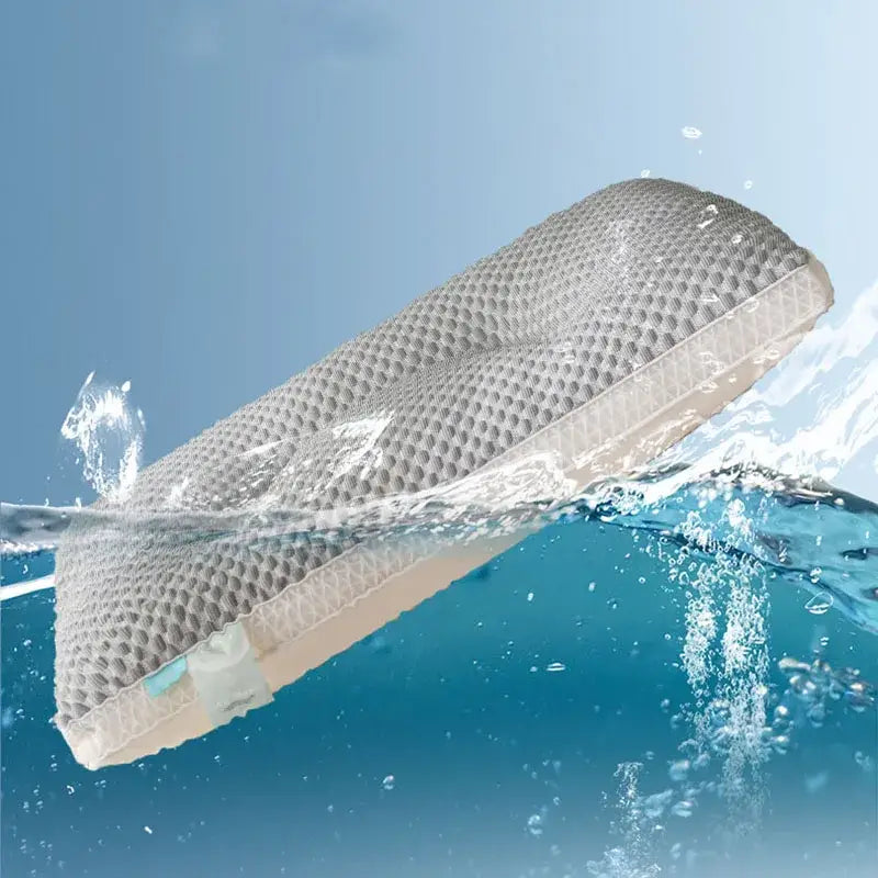 Gray honeycomb-patterned ice rayon cooling pillow with beige base for cervical neck support partially submerged in water