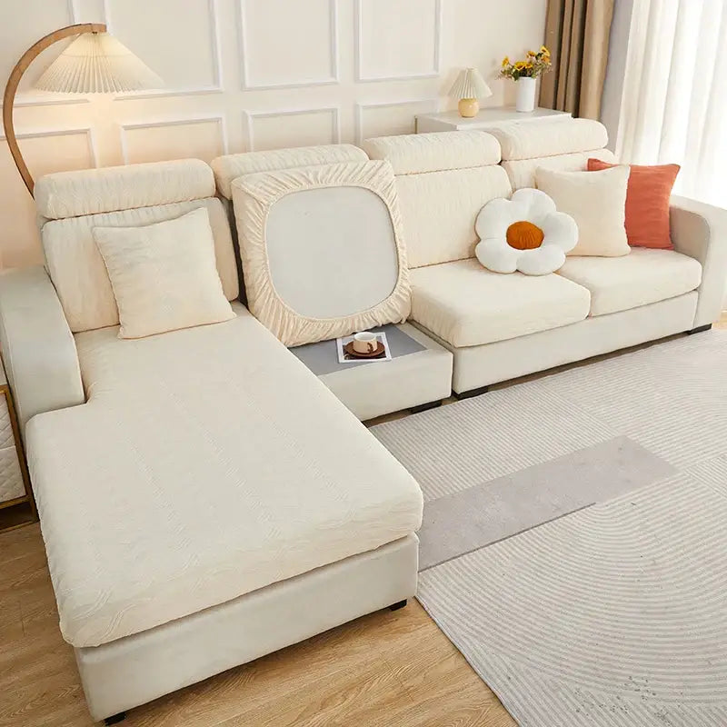 Cream-colored stretchy sofa cover with textured ribbed jacquard fabric and elasticized edges for decorbites jacquard sofa seat