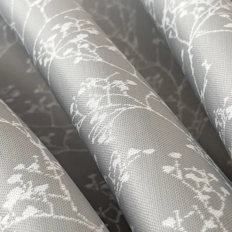 Gray fabric bed mat set with delicate white floral embroidery for bedroom cooling mattress use