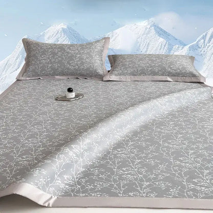 Gray satin bed mat set with white branch and blossom pattern and matching pillowcases for cooling mattress use
