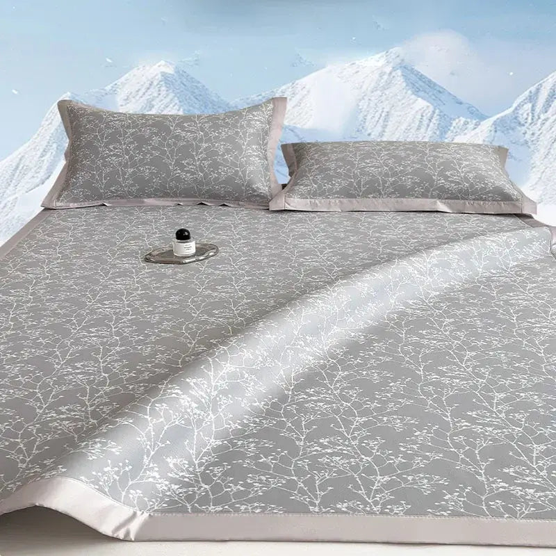 Gray satin bed mat set with white branch and blossom pattern and matching pillowcases for cooling mattress use