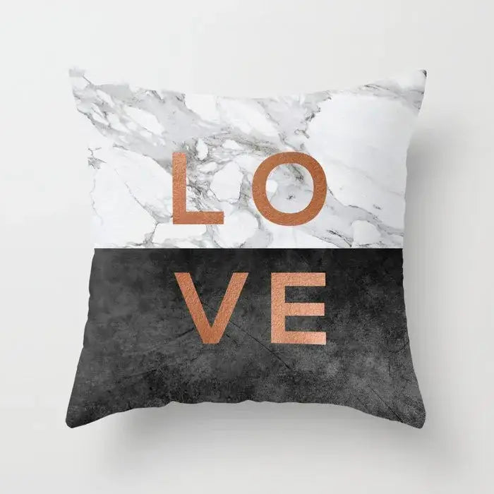 Square throw pillow case with gray marble top half black agate textured bottom half and rose gold love lettering