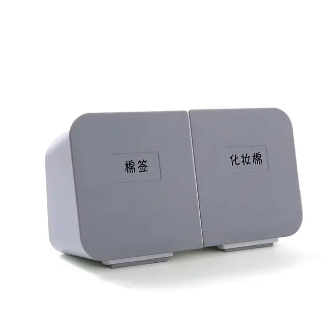Gray dual-compartment storage box with labeled sections for cotton pads and makeup cotton in decorbites cotton swab organizer