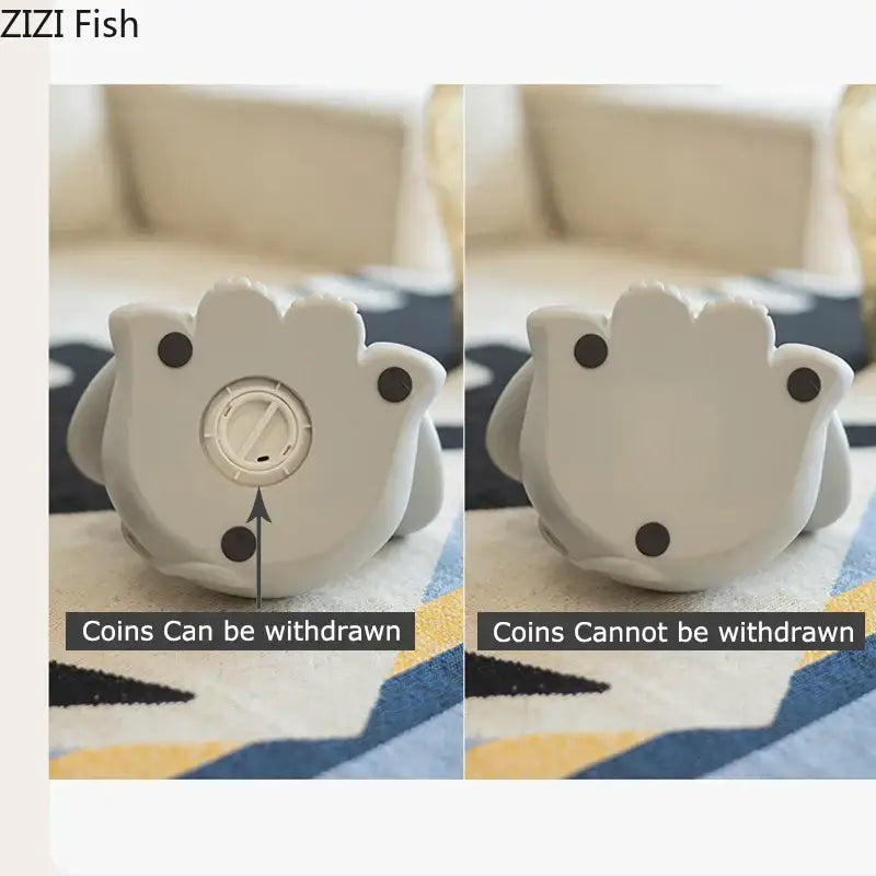 White silicone fish-shaped savings jar piggy with black feet and rotating dial for coin dispensing in nursery decor