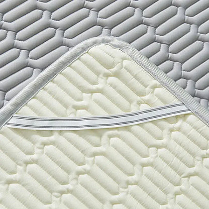 Cream-colored quilted mattress pad with hexagonal pattern and white elastic border for decorbites cooling latex summer mat set