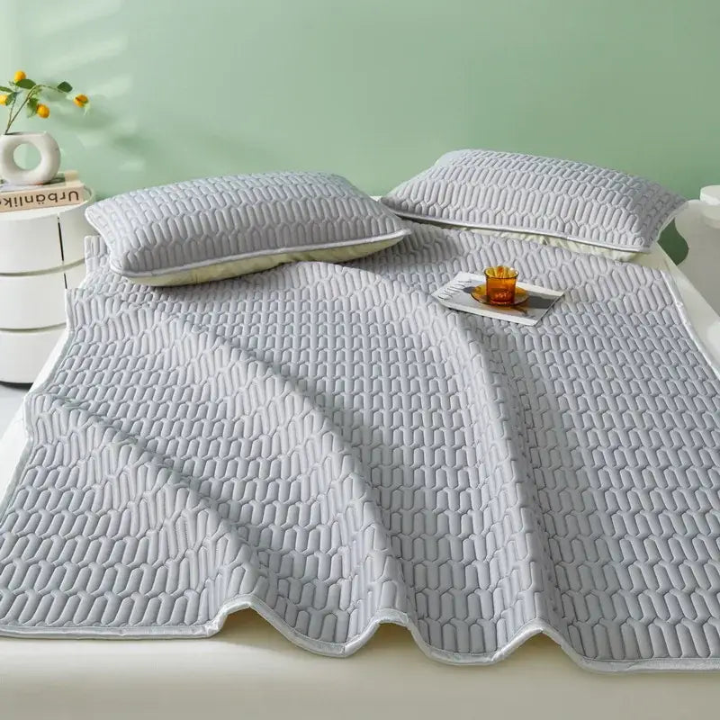 Light gray quilted cooling latex summer mat set with honeycomb texture and scalloped edges by decorbites