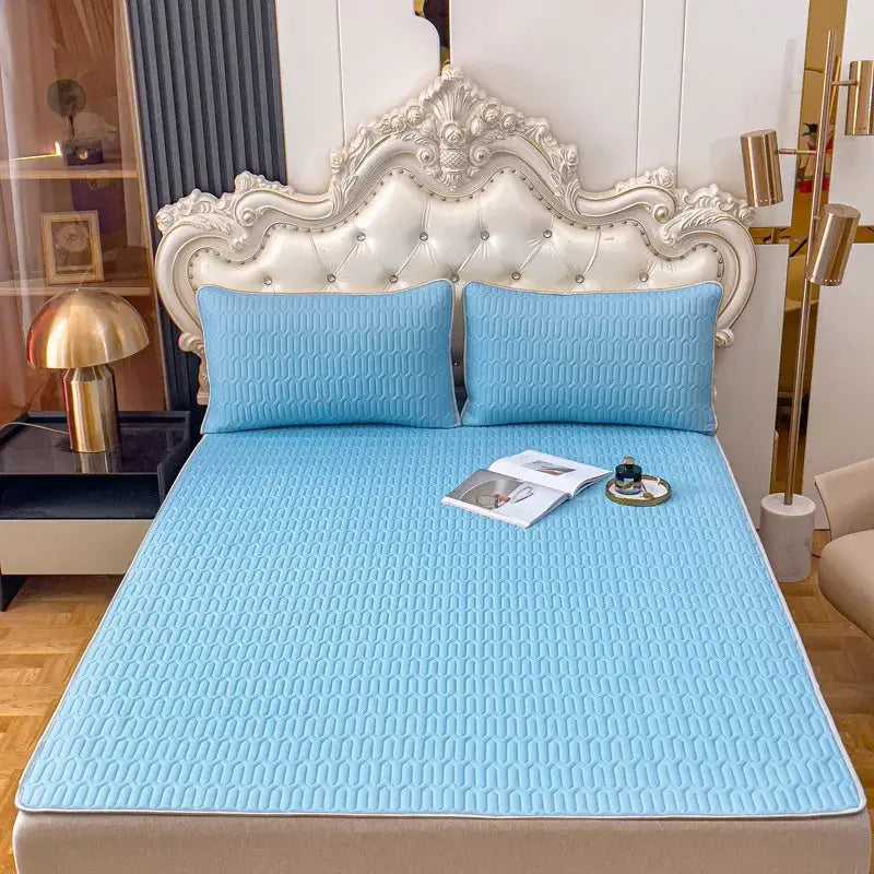 Light blue quilted bedroom bed pad with subtle geometric pattern in decorbites cooling latex summer mat set