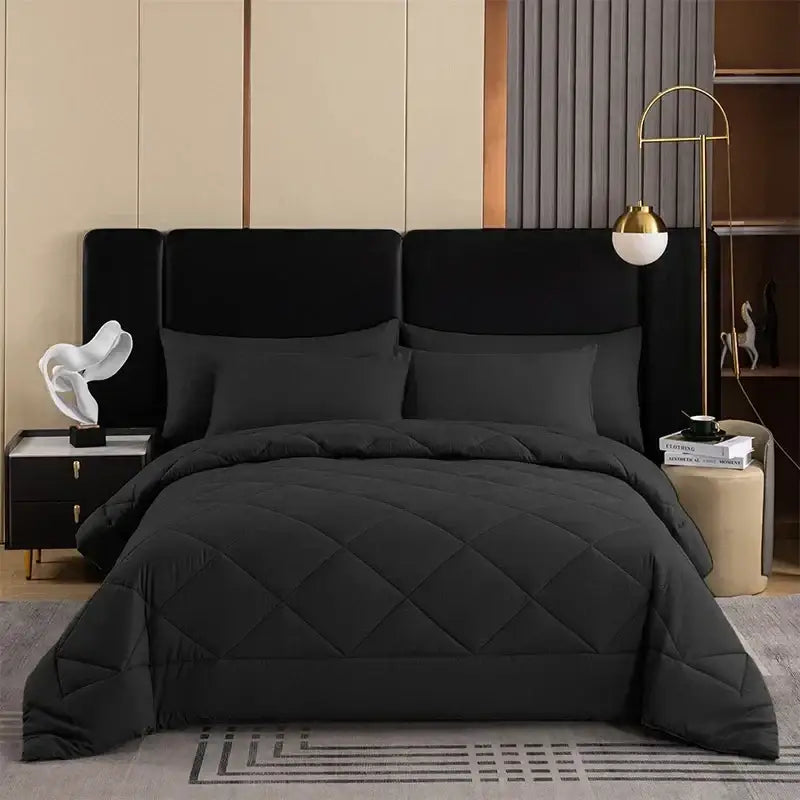 Black quilted comforter with diamond pattern as part of the decorbites cozy quilt set for bedroom use