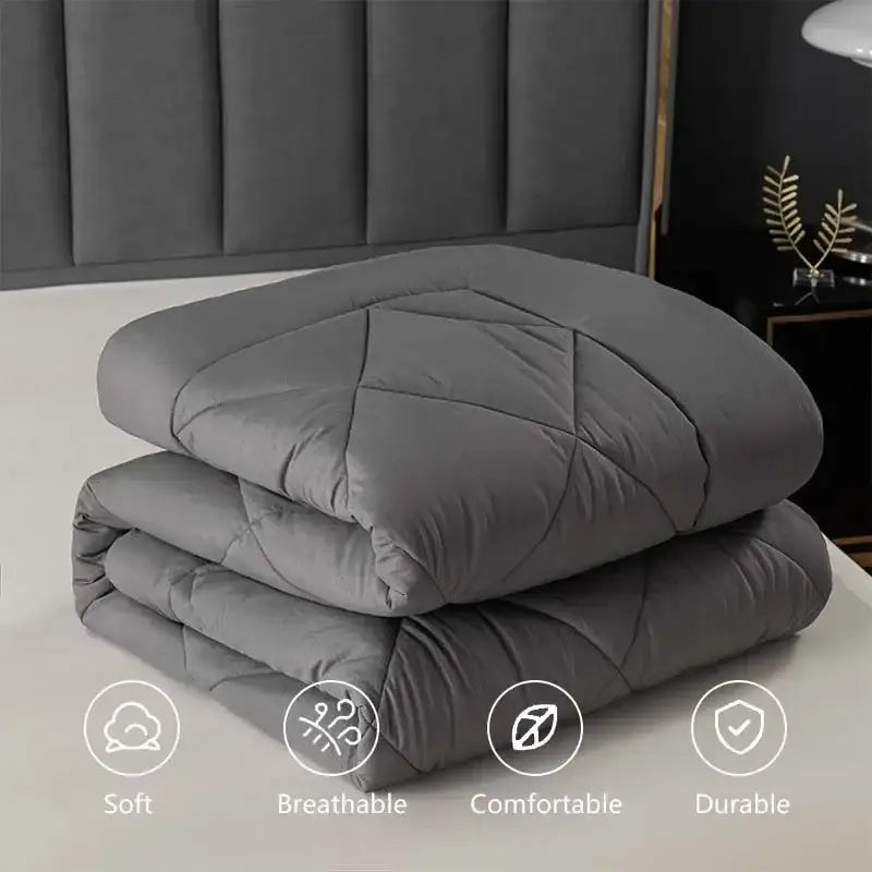 Stacked gray quilt with diamond-stitched pattern from decorbites cozy quilt set for soft bedroom comfort and decor
