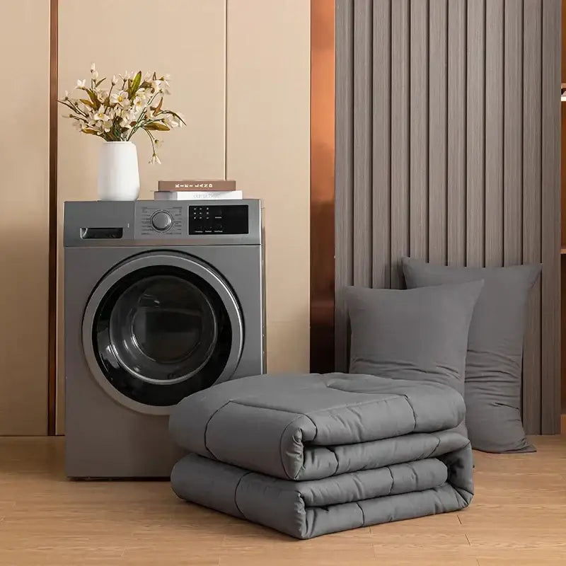 Gray quilted king size comforter with soft plush texture and subtle stitching patterns for bedroom use