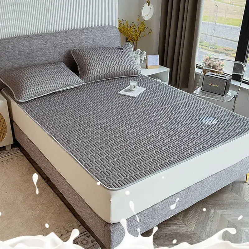 Gray quilted latex bed mat set with cooling mattress pad featuring subtle geometric pattern and stitched edges