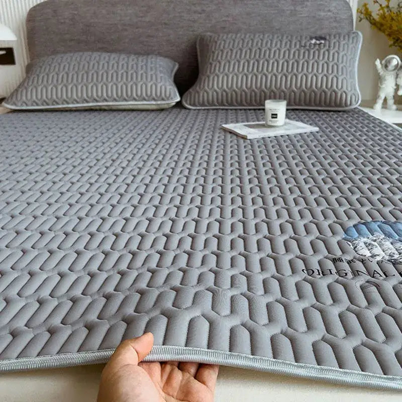 Gray quilted latex bed mat set featuring a honeycomb pattern and cloud embroidery for bedroom mattress protection