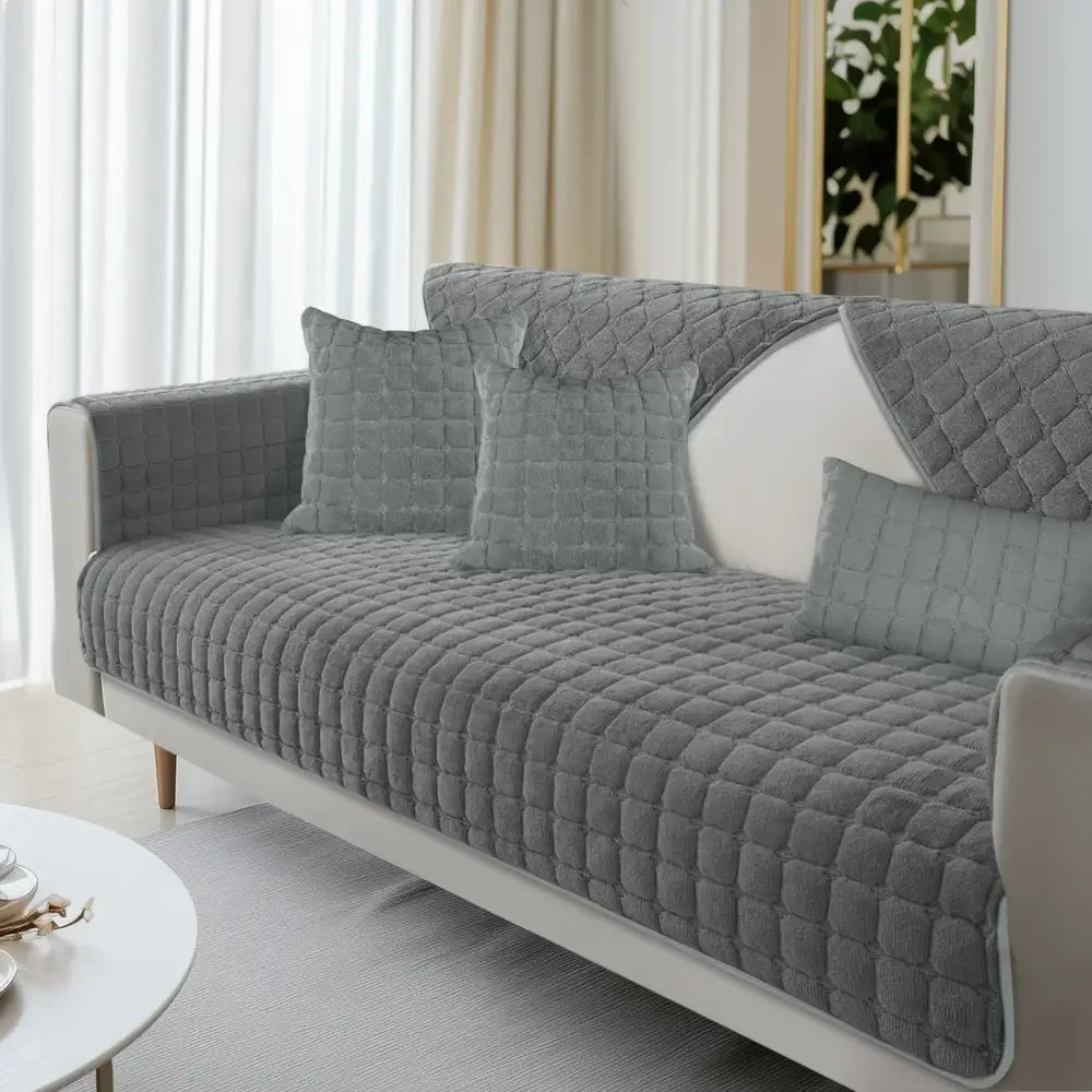 Gray quilted velvet plaid sofa cover featuring diamond-stitched pattern and soft plush texture for living room furniture protection