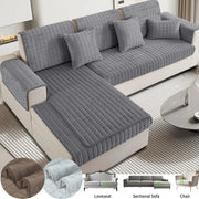 Gray quilted velvet plaid sofa cover with textured padded design for living room furniture protection