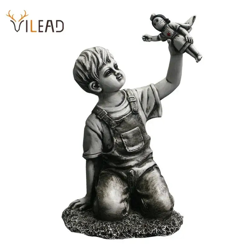 Gray resin super nurse angel boy statue kneeling in overalls holding a doll for living room decor