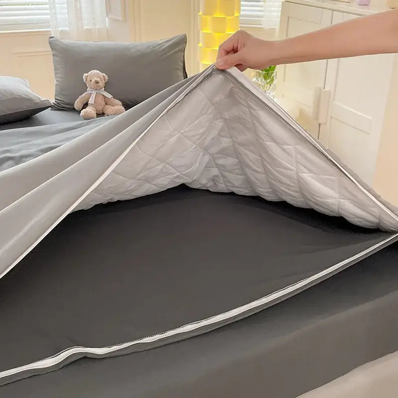 Gray satin cotton quilted duvet cover with white piping and matching gray inner lining from decorbites cotton quilted set