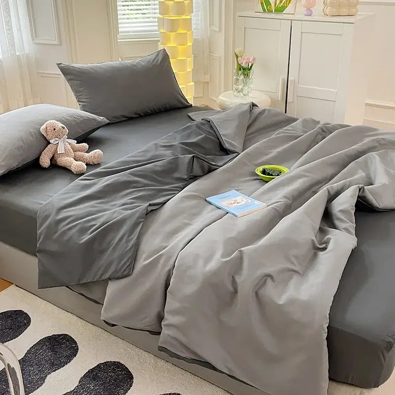 Gray satin cotton quilted duvet cover bedroom bedding set with matching pillowcases and slightly wrinkled duvet cover