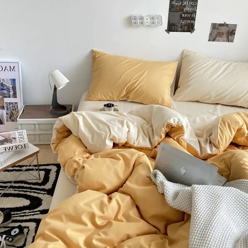 Warm yellow and cream-colored satin cotton quilted duvet cover from decorbites for elegant bedroom decor