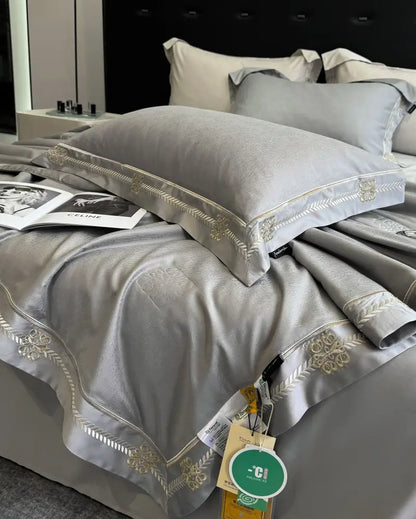 Gray satin eucalyptus fiber summer quilt bedding set with gold embroidered floral and leaf trim for decorbites