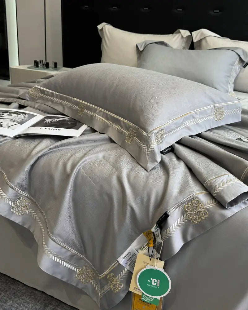 Gray satin eucalyptus fiber summer quilt bedding set with gold embroidered floral and leaf trim for decorbites