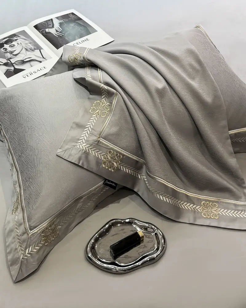 Gray satin pillowcase with gold embroidered floral and geometric trim from decorbites eucalyptus fiber summer quilt bedding set