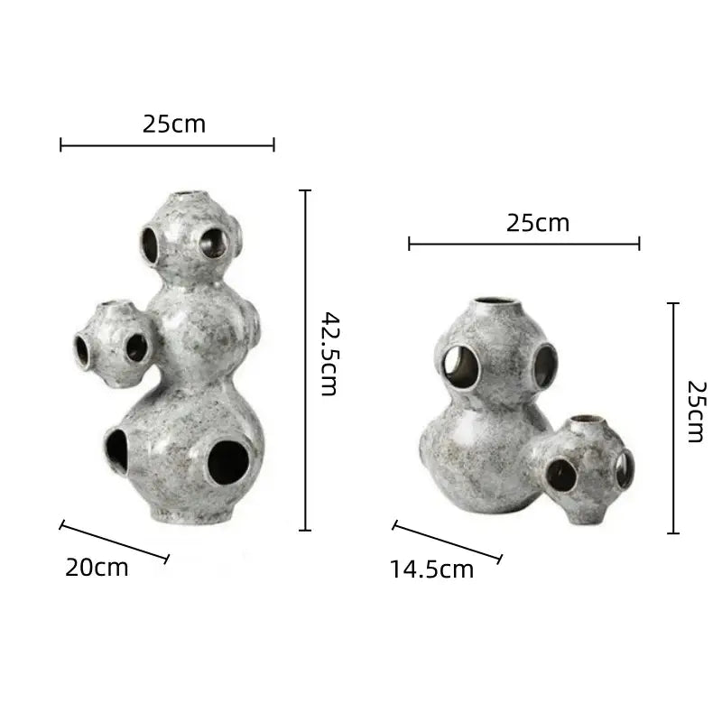 Gray speckled abstract planet ceramic ornament with silver textured spherical segments and circular openings for decorbites abstract planet decor