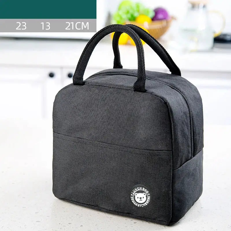 Black canvas insulated lunch bag with black fabric handles and white embroidered bear logo for kitchen use