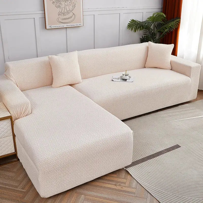 Cream-colored textured fabric sofa cover with matching pillows as decorbites jacquard sofa cover for living room