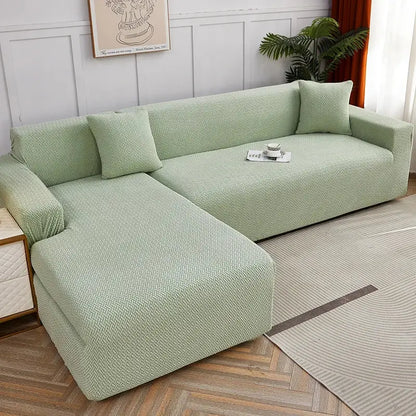 Light green textured decorbites jacquard sofa cover snugly fits an l-shaped sectional with pillows for living room use