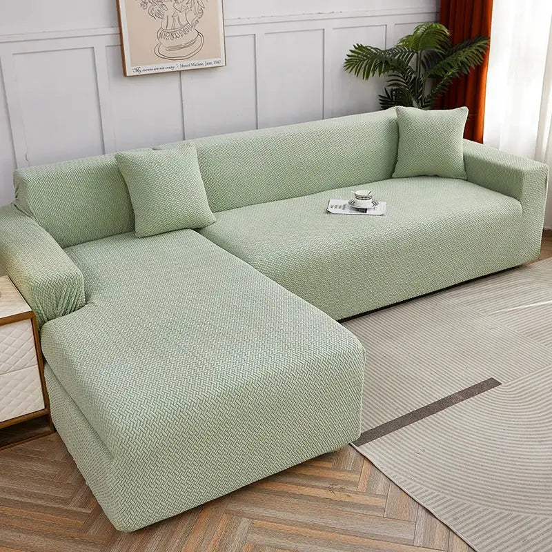 Light green textured decorbites jacquard sofa cover snugly fits an l-shaped sectional with pillows for living room use