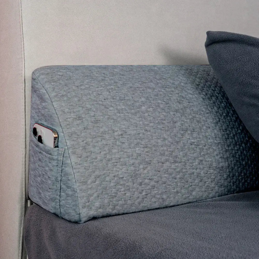 Gray textured memory foam bed wedge pillow with built-in phone pocket for bedroom mattress gap filler use