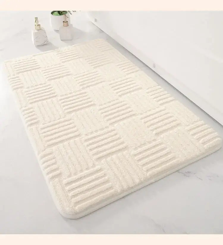 Cream-colored bath mat with textured raised grid pattern suitable as a non slip striped floor mat for bathroom use
