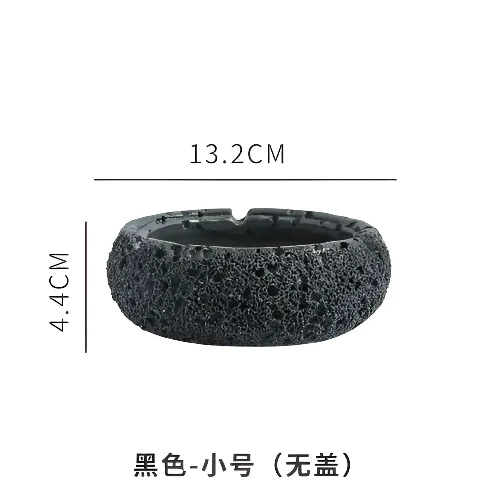 Black lava rock small ashtray without lid designed as a gray cement astronaut ashtray for living room use