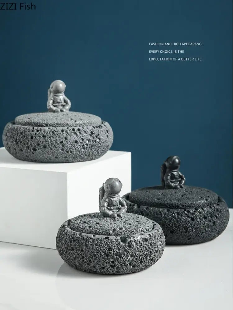 Gray volcanic stone cement astronaut ashtray with miniature astronaut lids designed by zizi fish for living room use